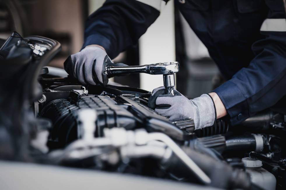 a person is repairing the car